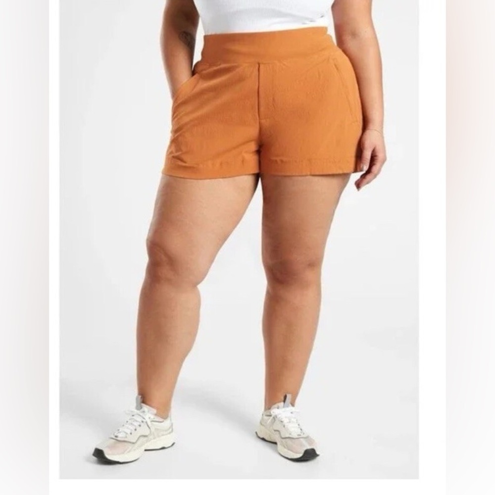 Athleta Trekkie North shorts in a burnt orange or rust color 14
